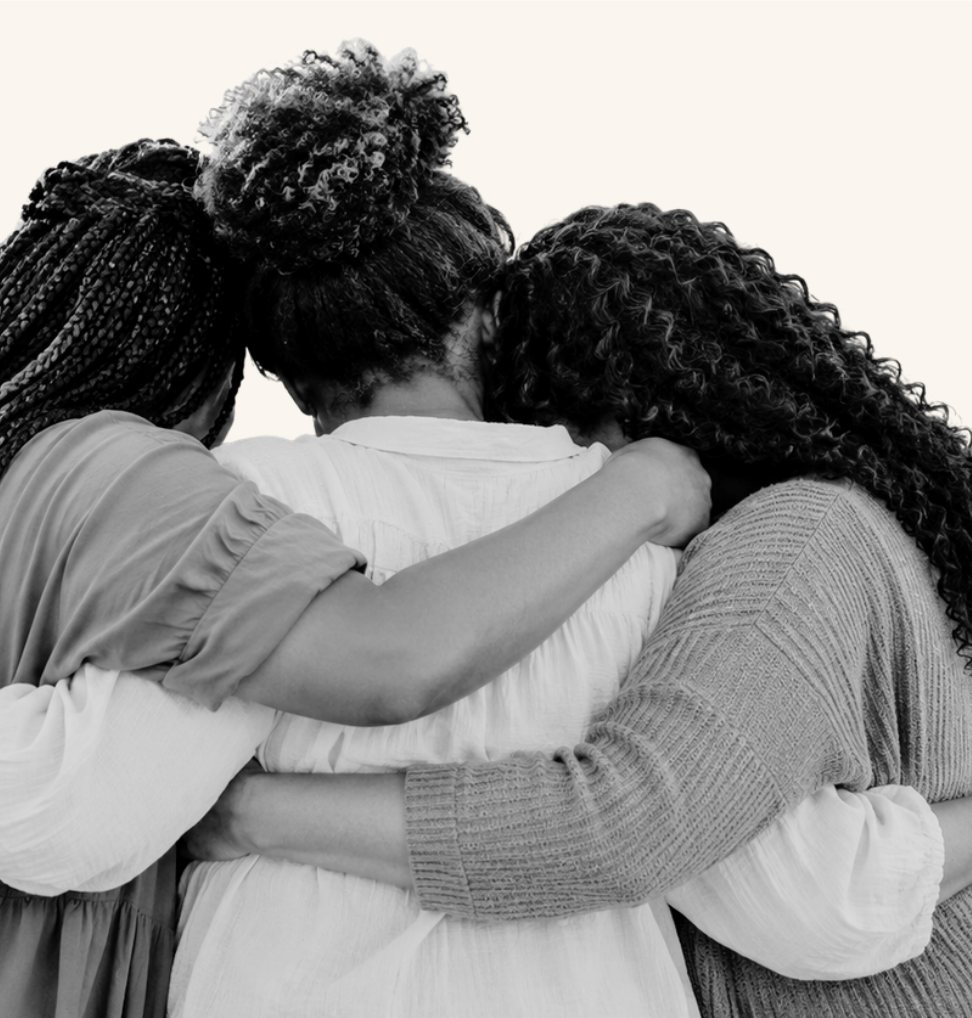 Women embracing in a group hug