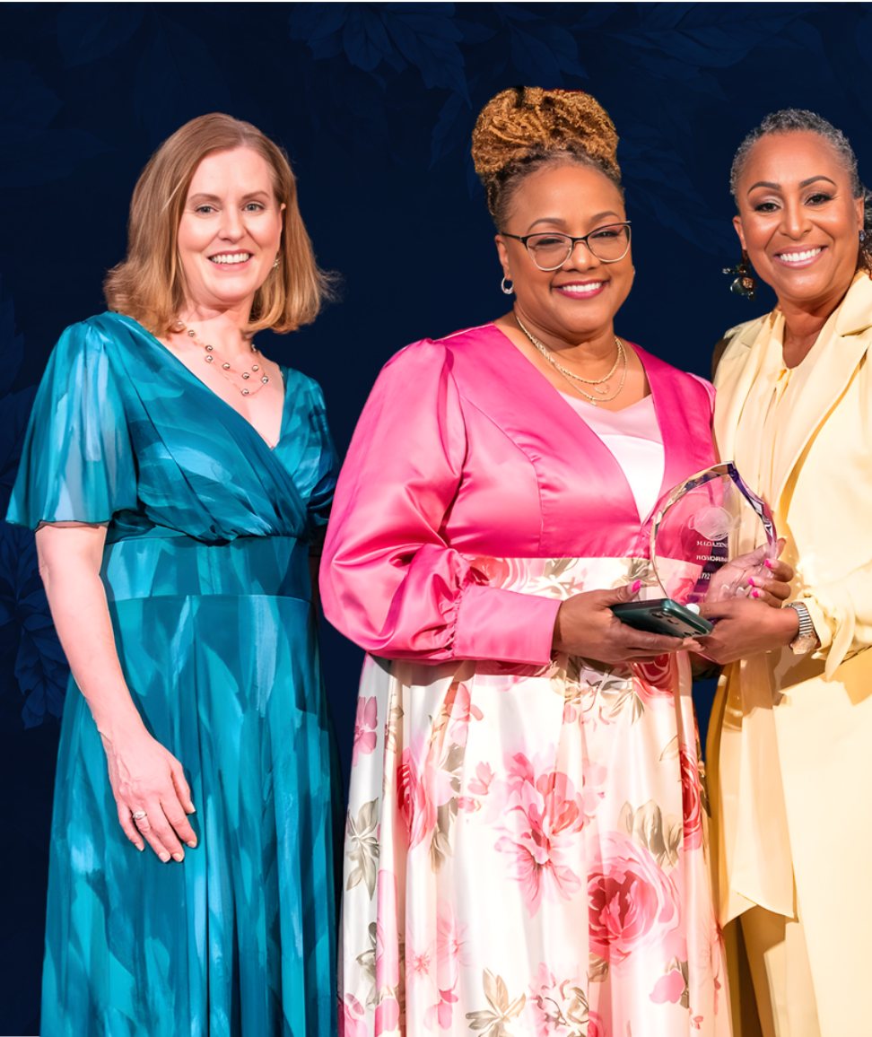 Dr. Cheryl Polote-Williamson presenting a Women of Influence award